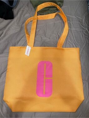 Clinique Bright Yellow Canvas Tote with Pink Logo